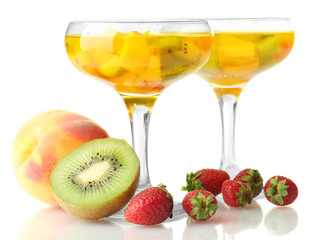 punch in glasses with fruits, isolated on white