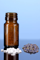 bottle with pills and herbs