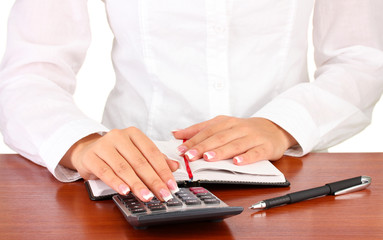 Woman's hands counts on the calculator, close-up