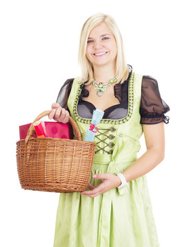 Young woman carries a basket with gifts