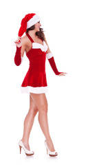 side view of a sexy young santa woman walking