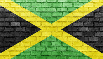 Jamaica flag on a brick wall