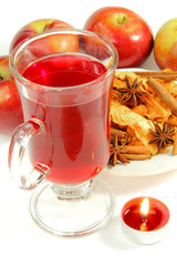 Cup of tea and fruits with candle