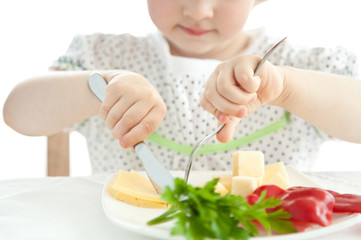Little girl eating her dinner