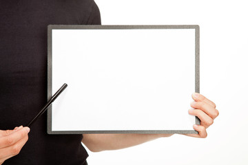 Woman's hands holding clipboard with blank sheet of paper