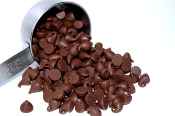 Scoop of Chocolate chips on white background