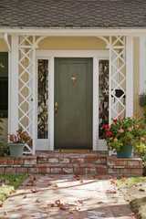 Green and rustic front door in Autumn.