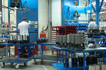 Workers on manufacturing plant