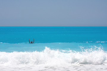 lone swimmer in big waves
