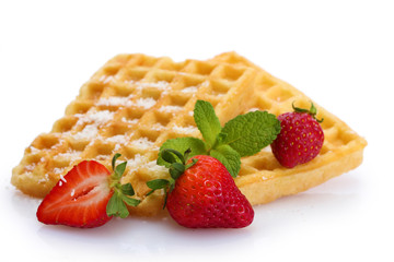 belgium waffles with strawberries and mint  isolated on white