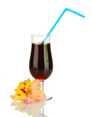 glass with cocktail and gladiolus bud isolated on white