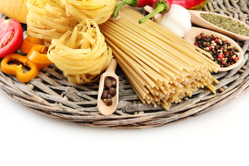 Pasta spaghetti, vegetables and spices, isolated on white