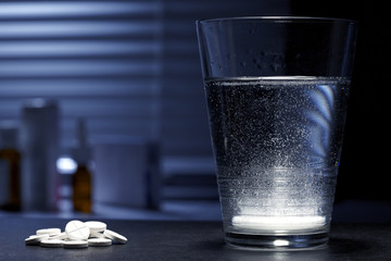 Fizzy effervescent tablet in a glass