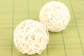 wicker bamboo balls on bamboo mat