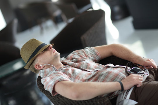 Man resting in armchair