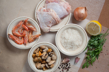 Ingredients for Paella ready meal with shrimp, chicken