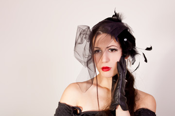 Beautiful young widow wearing black veil