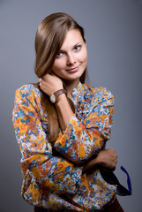 Portrait of a beautiful girl with sunglasses in hand