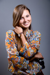 Portrait of a beautiful girl with sunglasses in hand