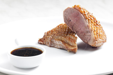 fried duck breast with sauce of honey, balsamico and red wine