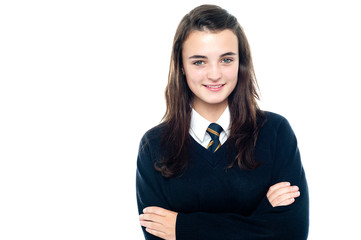Confident young school child in uniform