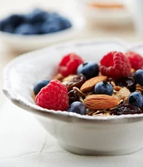 Foto auf Acrylglas Bowl of granola with fresh fruits and almonds © B.G. Photography