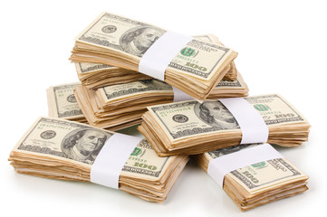 Stacks of one hundred dollars banknotes close-up isolated