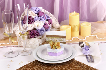Serving fabulous wedding table in purple and gold color