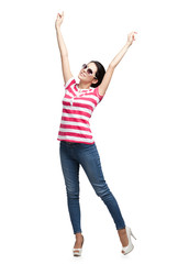 Happy dancing teenager with arms up, isolated. Fashion woman