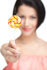 Woman offers sweet, isolated on white