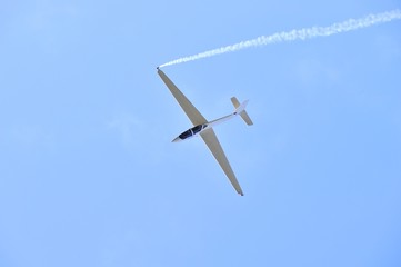 glider aerobatics with smoke