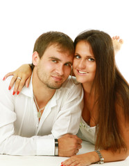 A young couple lying on the floor