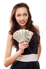 A young woman with dollars in her hands, isolated on white