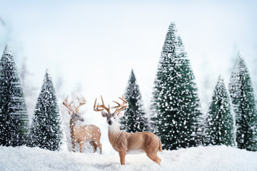 Winter landscape with deers,snow and fir tree.