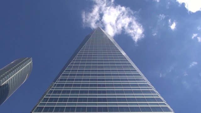 pyramid skyscraper with clouds on top