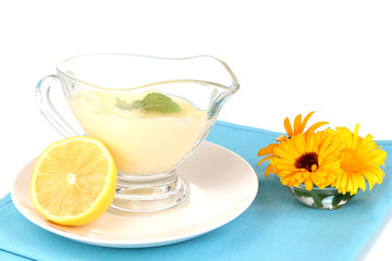 Mayonnaise in bowl on napkin isolated on white