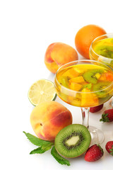 punch in glasses with fruits, isolated on white