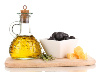 Black olives in white bowl with rosemary,olive oil and cheese