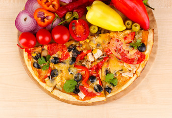 Delicious pizza with ingredients close-up