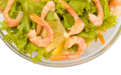 salad with shrimps, lemon and lettuce leaves in bowl, isolated