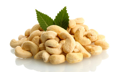 tasty cashew nuts with leaves, isolated on white