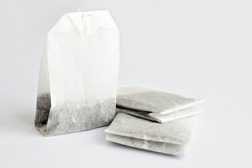 Closeup image of tea bags on white table