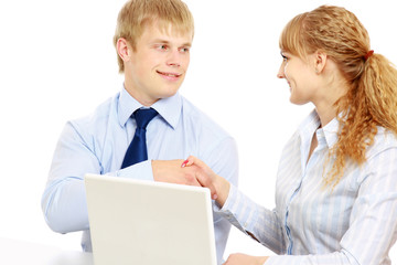 Businesspersons working at the desk with a laptop