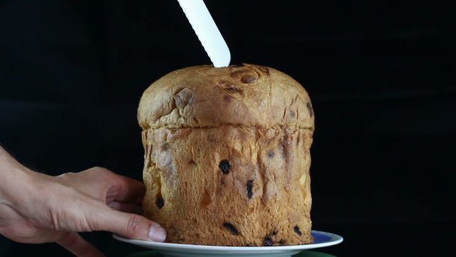 panettone Italian traditional cake over black background