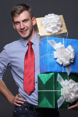 Portrait of young business man with gifts