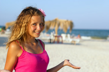 Fototapeta na wymiar happy teen girl on the beach