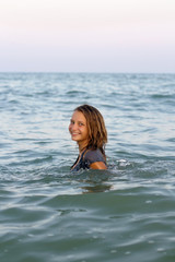 smiling teen girl in the sea