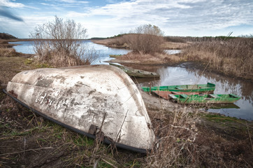 Upturned boat in the river