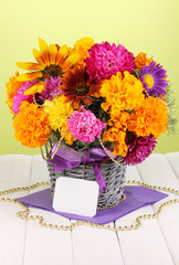 Beautiful bouquet of bright flowers with paper note