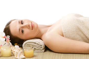 Obraz na płótnie Canvas An attractive young woman receiving spa treatment